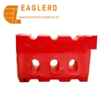 Durable red and yellow plastic traffic barrier for roadway safety